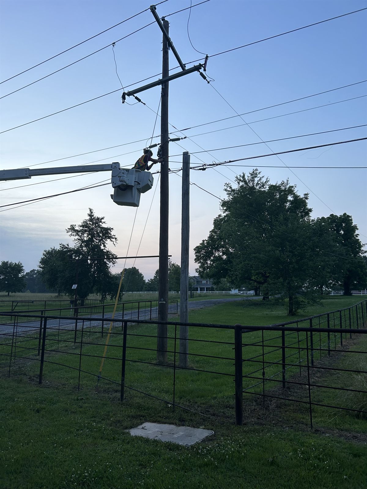 ClearSpan bucket truck set up on a rural distribution line at first light