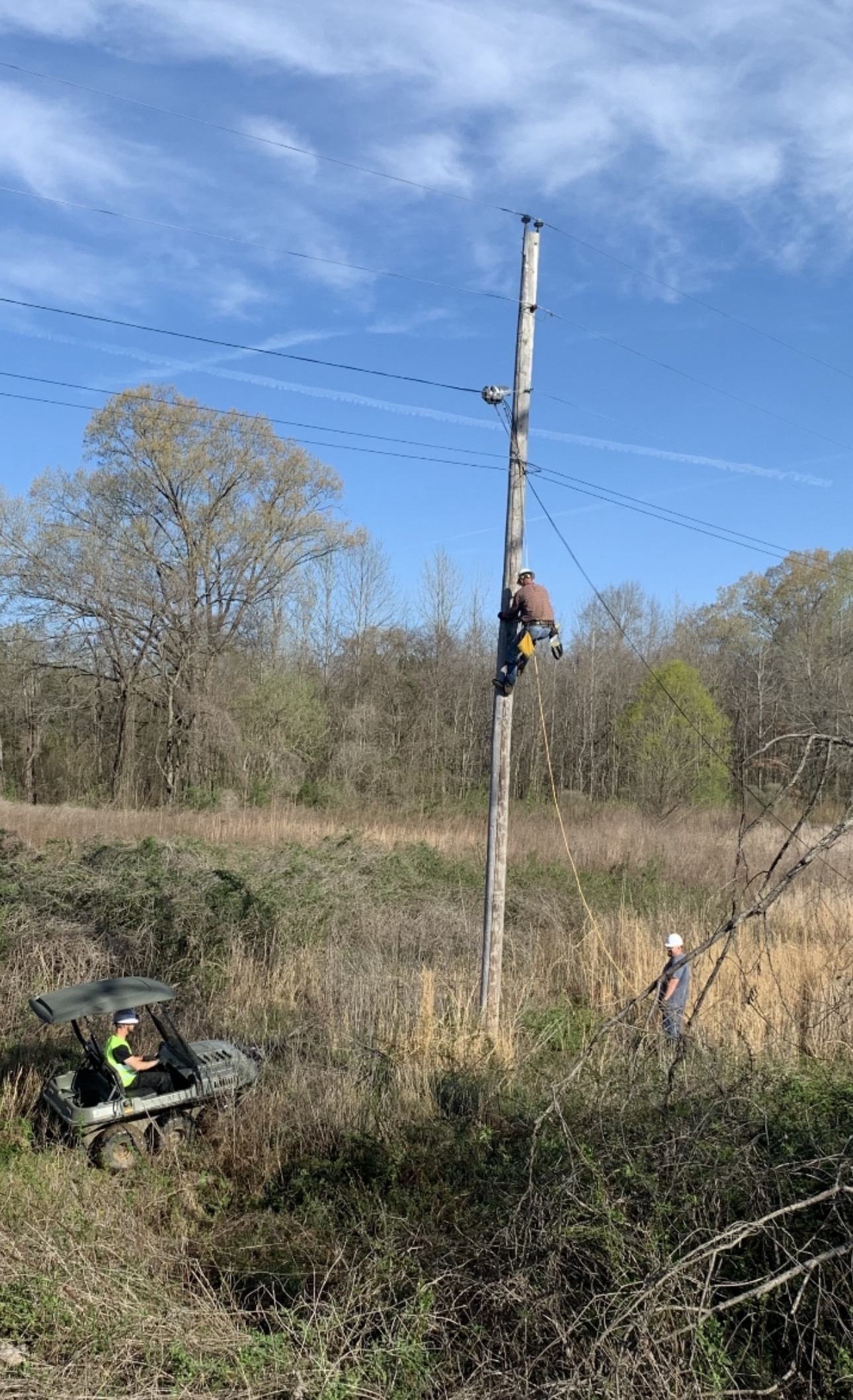 Pole climb and field crew in a rural aerial fiber environment